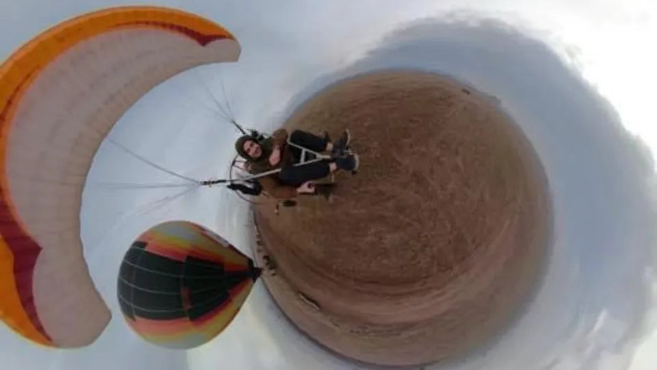 Passenger and instructor on a tandem paratrike flight in the Sofia region