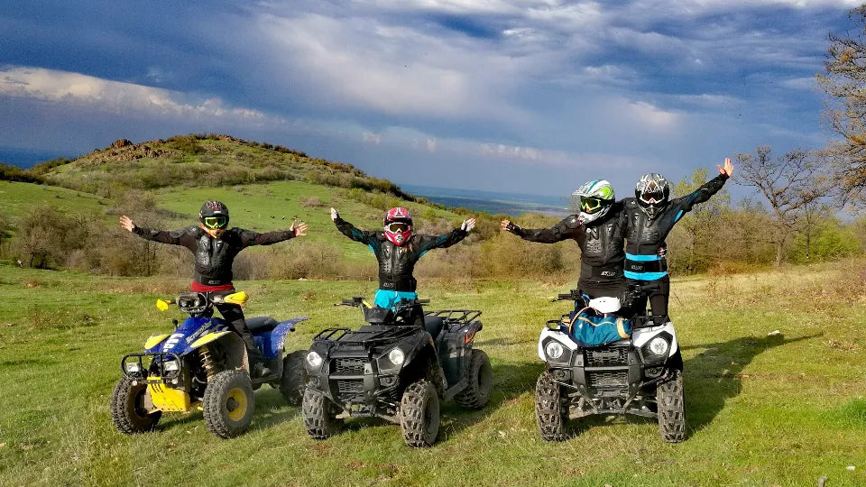 Two riders sharing one Kawasaki Brute Force ATV off-road near Haskovo