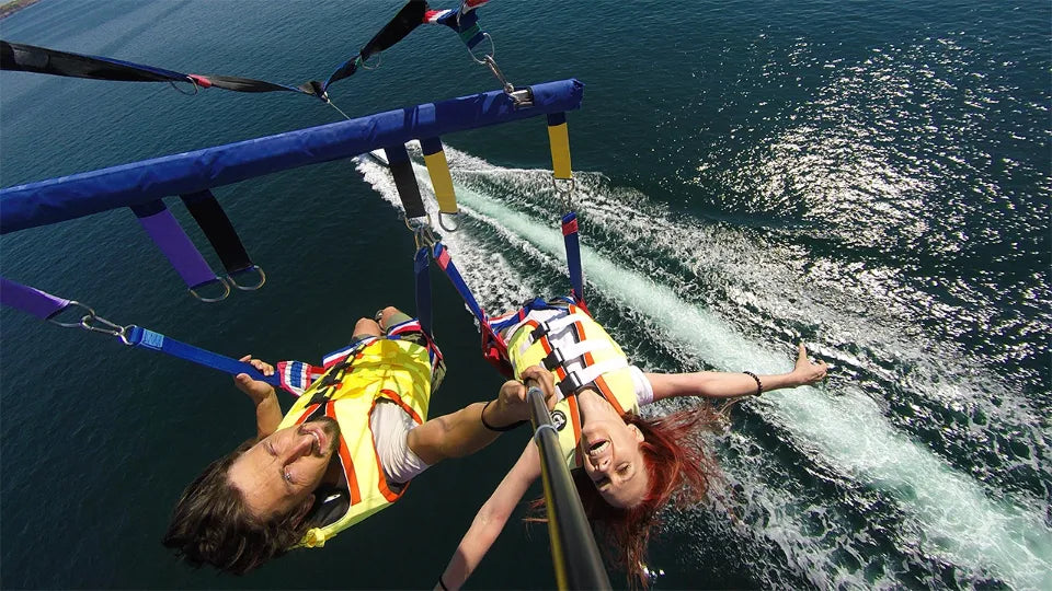 Tandem parasailing take‑off from a paracraft boat at Smokinya Beach