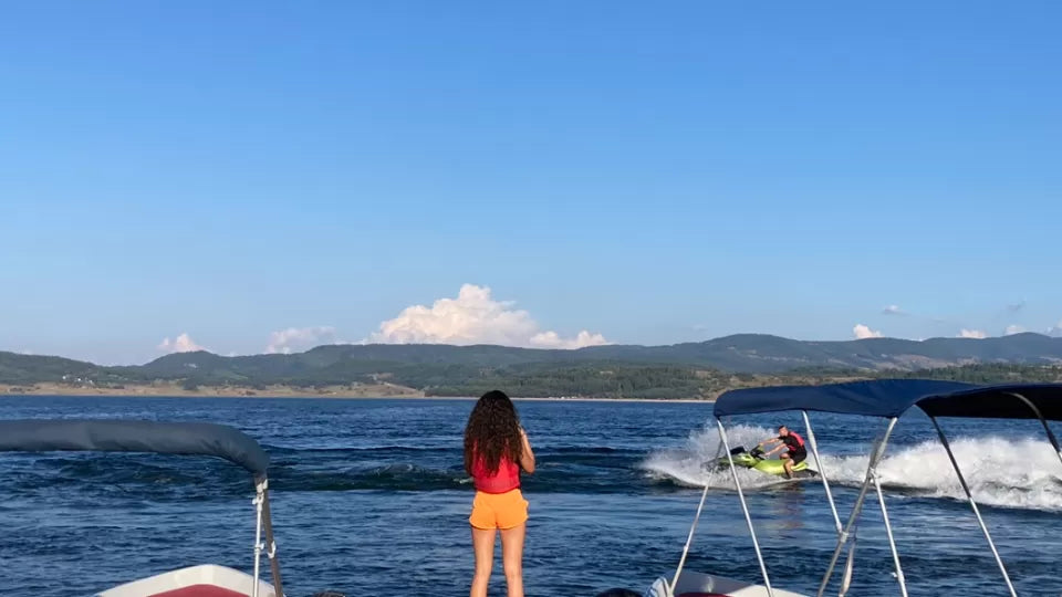 Cruising near the island on Batak Reservoir in a motorboat
