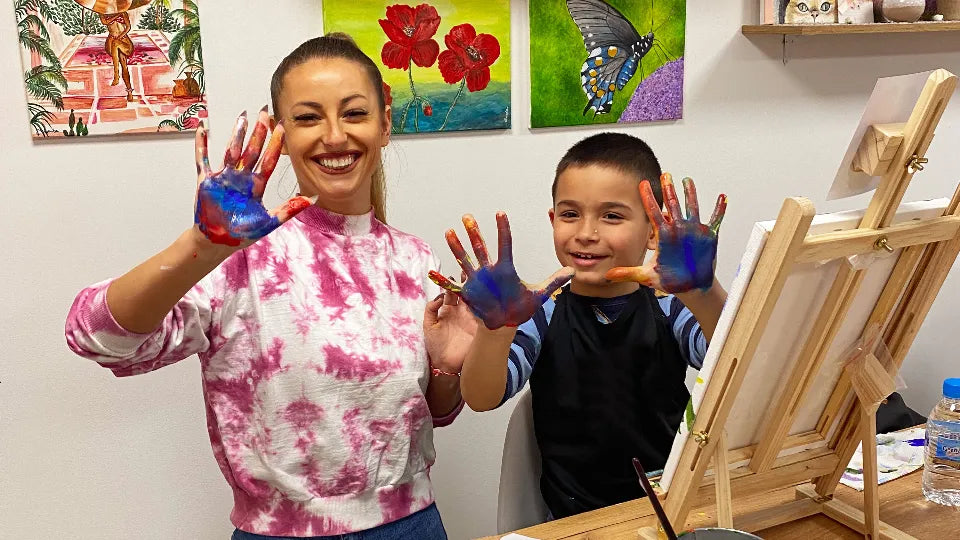 Participants painting on 40×30 cm canvases in Sofia studio