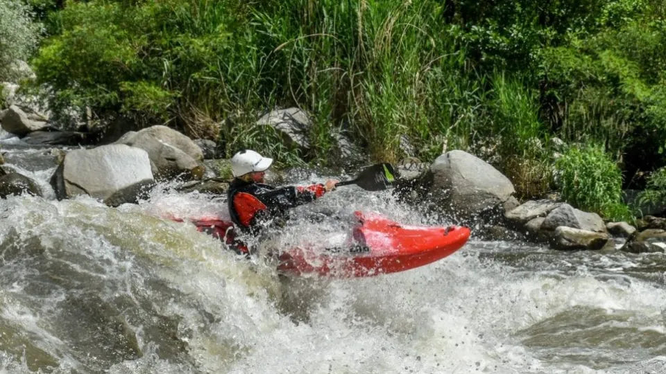 Surfing waves and practicing the kayak roll on the Struma River