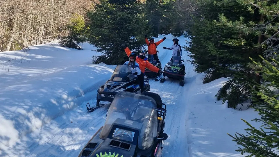 Solo snowmobile driving with helmet and goggles at Petrohan