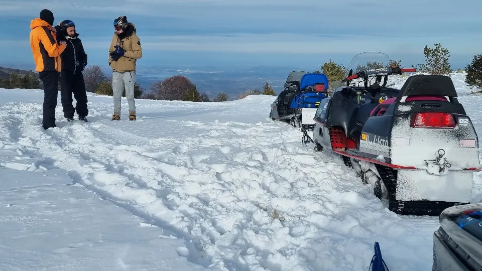 Guided group on a challenging snowmobile trail at Petrohan