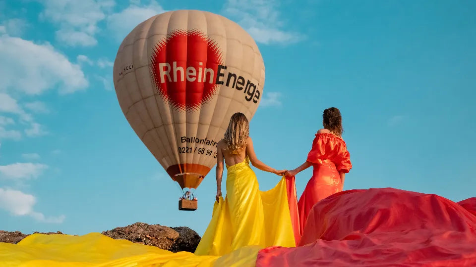 Woman in an ethereal dress posing at the Belogradchik Rocks at sunset
