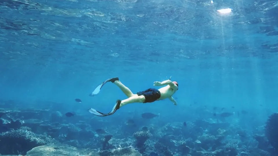 Instructor guiding snorkeling techniques in the sea at Nessebar