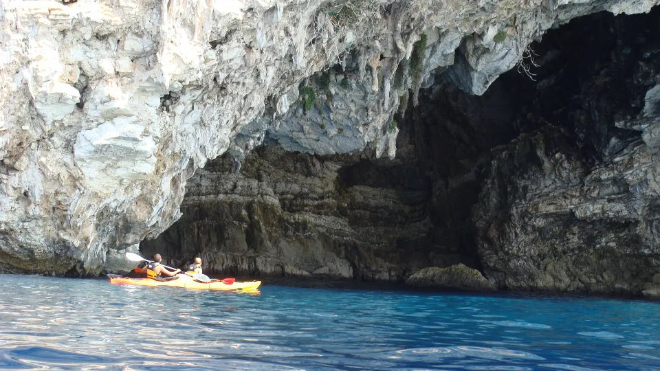 Guided tandem kayak on calm lake waters with full gear