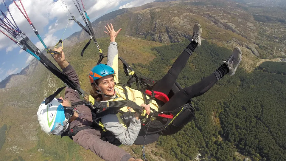 Mid-air acro paragliding moment over Sopot