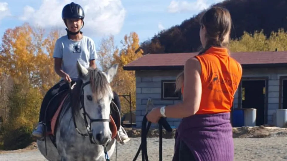 Beginner riding a calm horse on an arena near Svoge