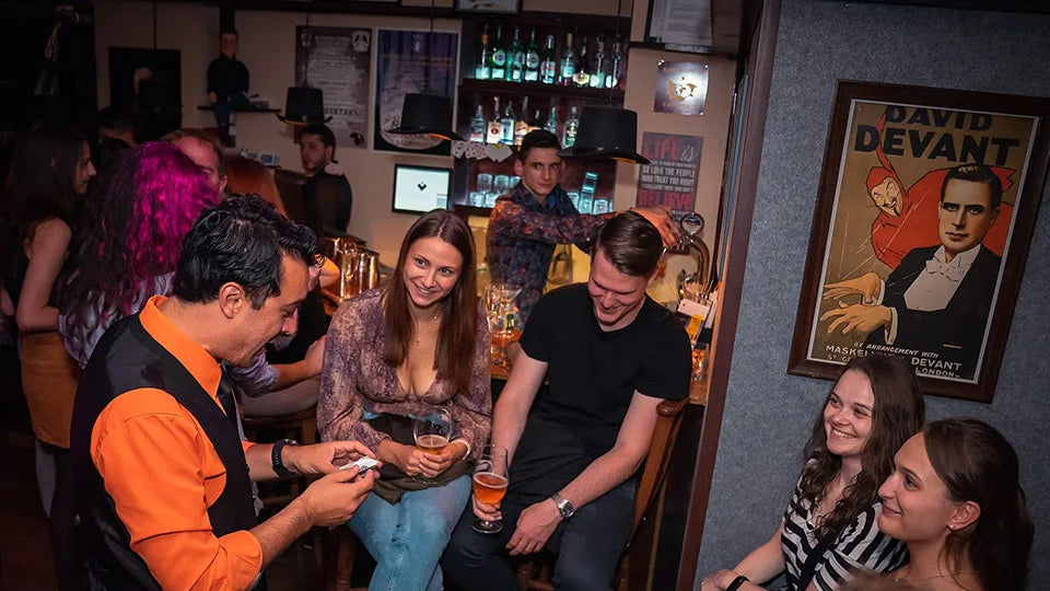 Magician on a small stage during a Sofia magic show