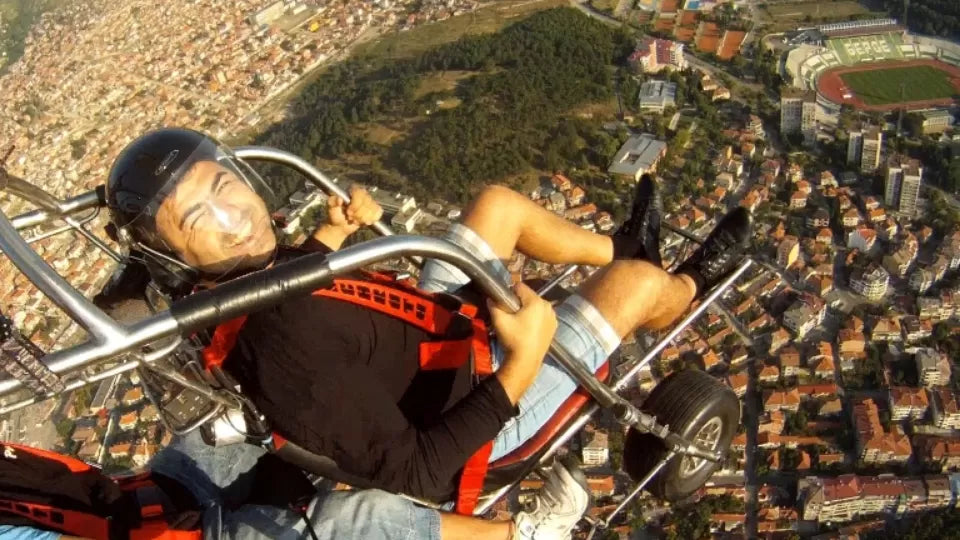Tandem paratrike over the green Sredna Gora hills