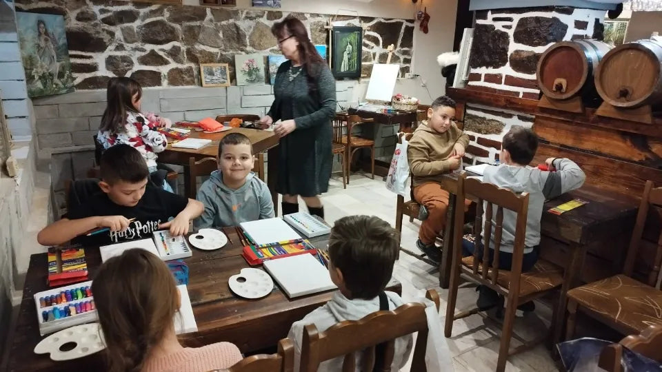 Children enjoying art class with included menu and drinks