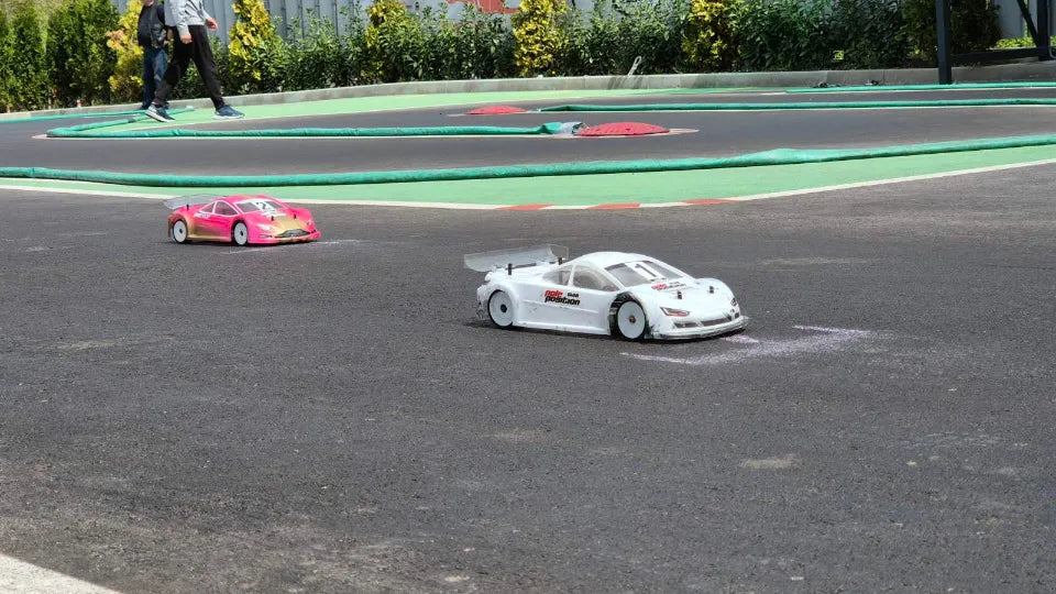 Instructor guiding RC car driving at Sofia track
