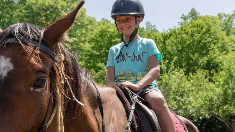 Children riding horses in the arena at Zasele, Svoge area