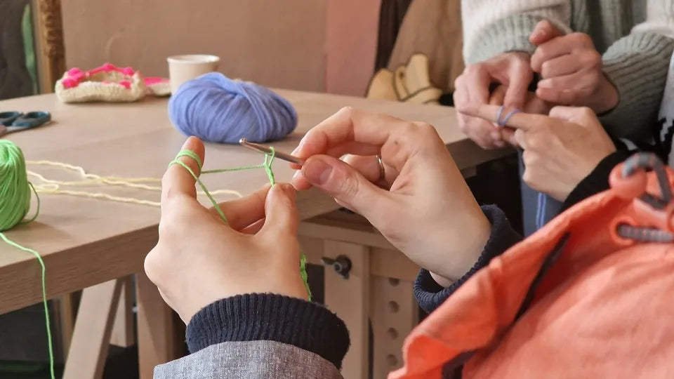 Group crochet workshop with yarn, hook, and light refreshments in Sofia