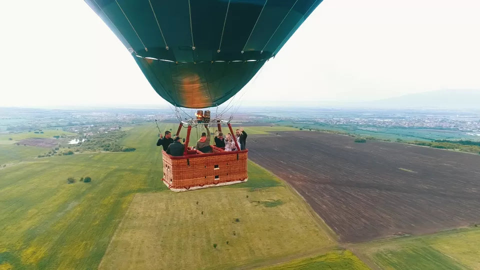 Hot air balloon over fields at sunrise near Sofia North