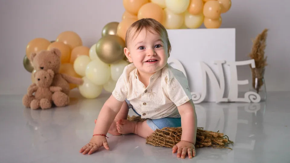 Styled cake smash set with balloons and pastel colors in a Sofia studio