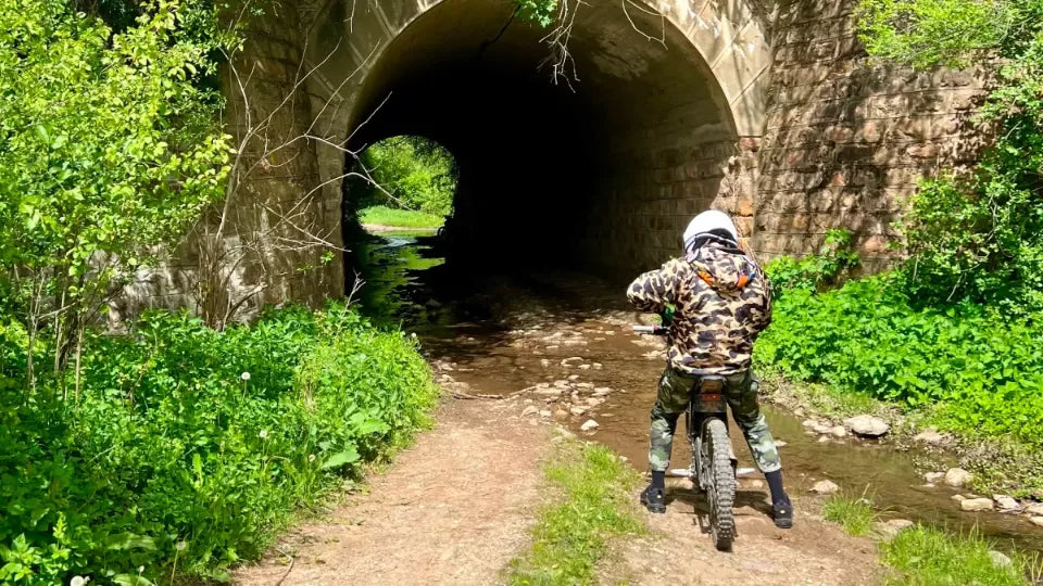 Sur-Ron electric dirt bike on trails near the Melnik Pyramids