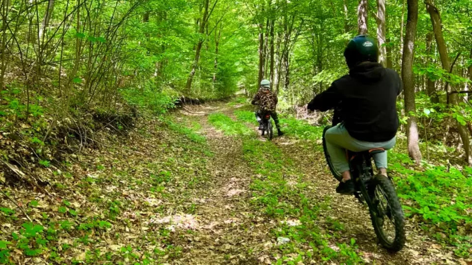 Protective gear for electric dirt bike riding: helmet, goggles, knee pads, body armor