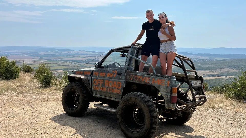 Modified Daihatsu 4x4 on a panoramic off‑road route