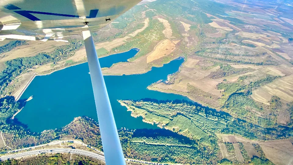 Dual‑control aircraft flight lesson above the Rila Mountains