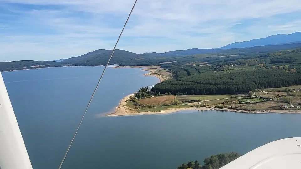 Amphibious flying boat in the air above Lake Iskar
