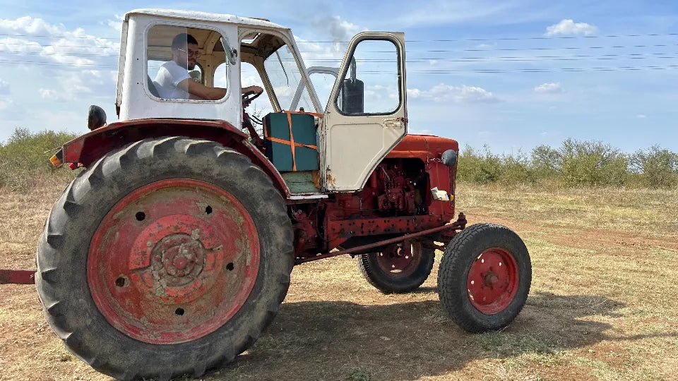 Instructor guiding tractor driving in Arbanasi, Veliko Tarnovo
