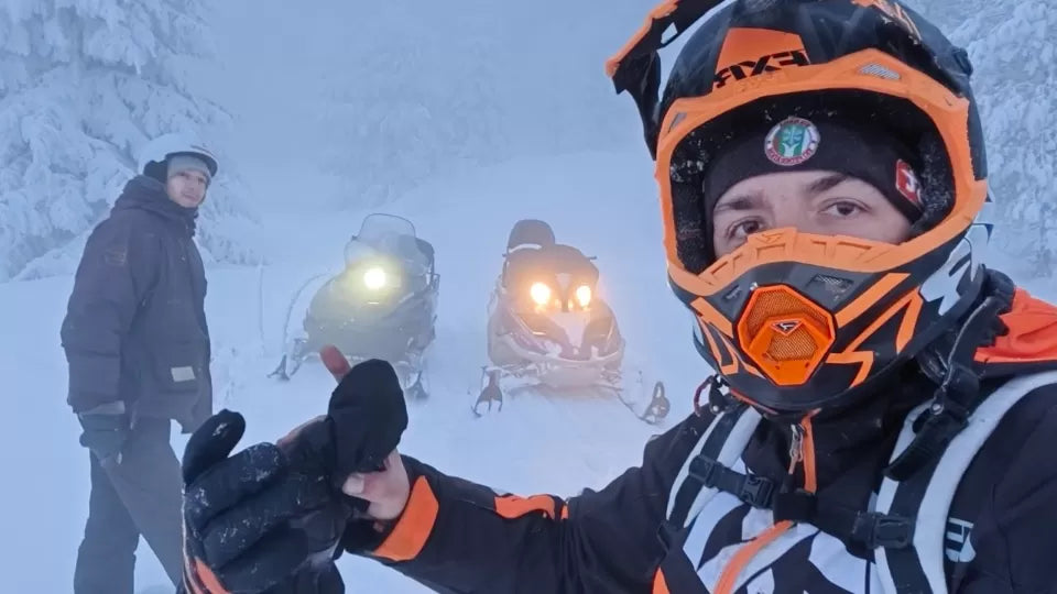 Snowmobile tracks during a night tour in the Petrohan area