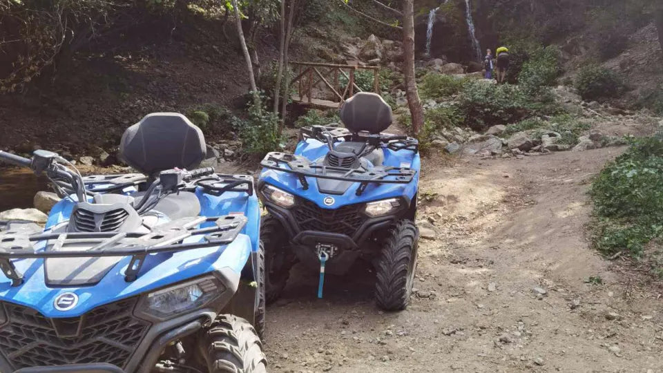 Two riders on one ATV in Pirin near Dobrinishte