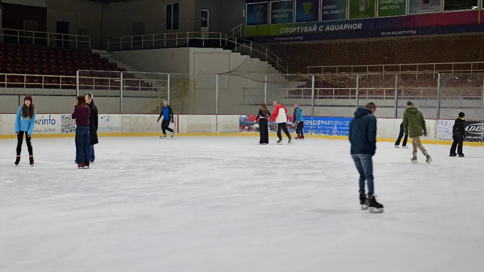 Indoor Slavia Ice Rink Sofia – couple skating with rental skates