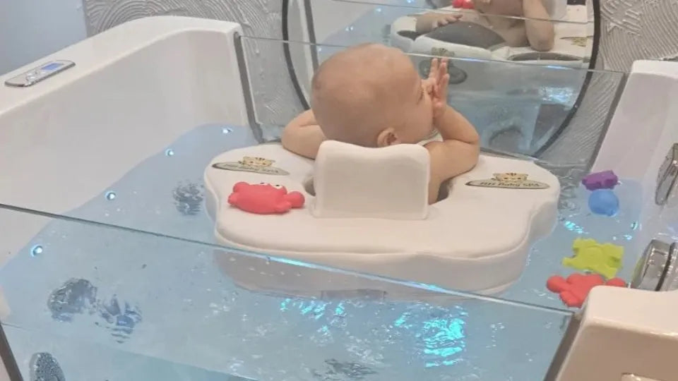 Baby flotation in Burgas with a neck float in warm water