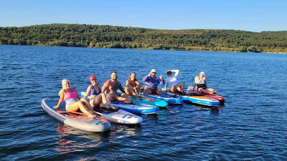 Photo break during a stand up paddleboarding experience