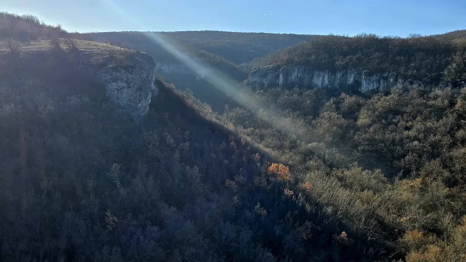 Hot air balloon rising above the Krushuna Waterfalls area