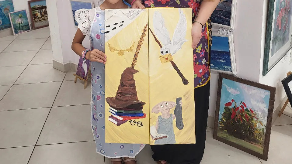 Artist guiding parents and children during a painting class in Sofia