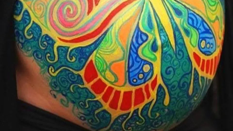 Gentle pregnancy body painting during a one‑to‑one therapy session in Sofia