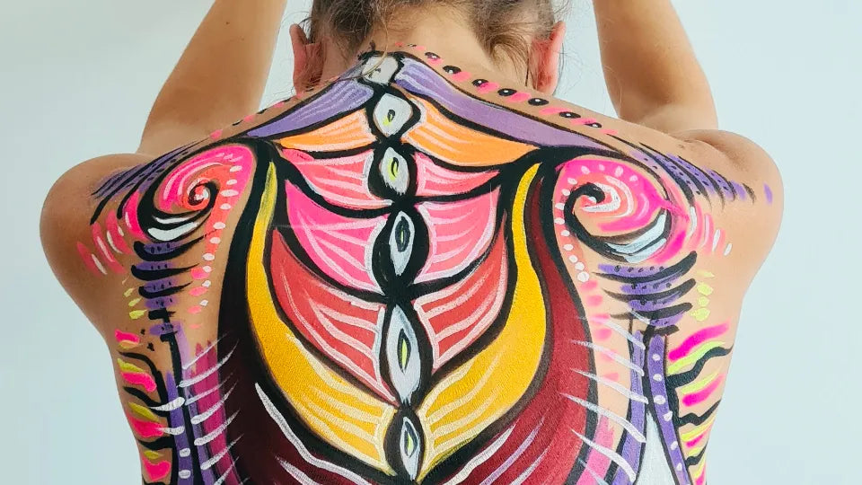 Artist painting with brushes on the body in a Sofia studio