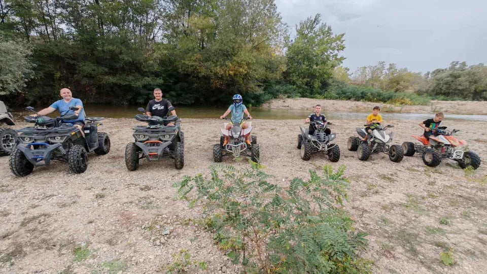 Group family ATV experience with helmets and goggles in Kalekovets