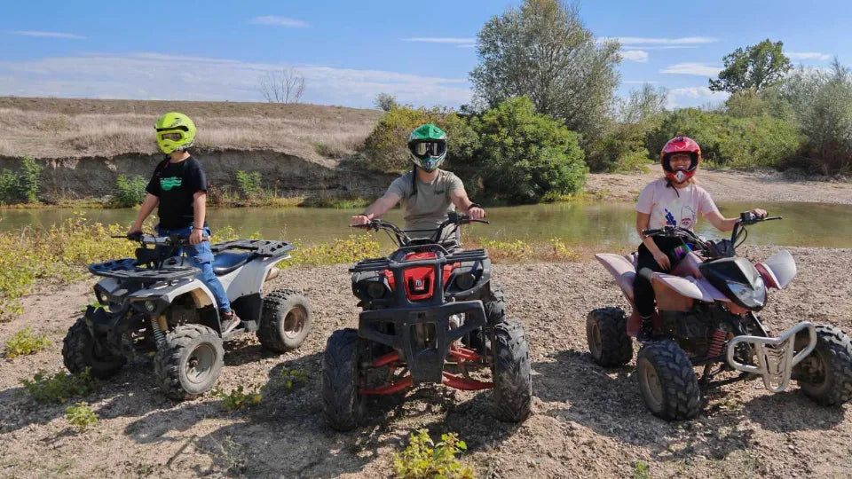 Parent and child on ATVs during a family off‑road ride in Kalekovets, Plovdiv