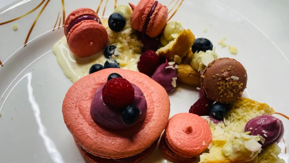 Dessert course in Sofia with macarons, sponge cake, and ice cream