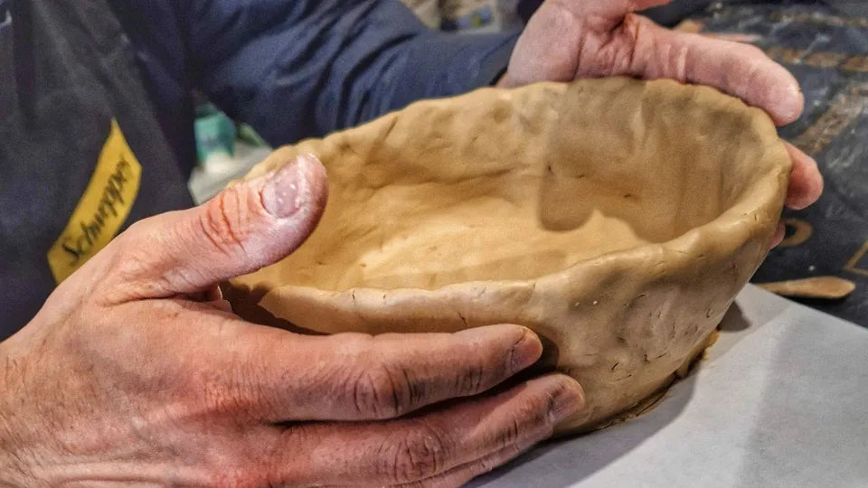 Team building pottery class in Sofia – hands shaping clay