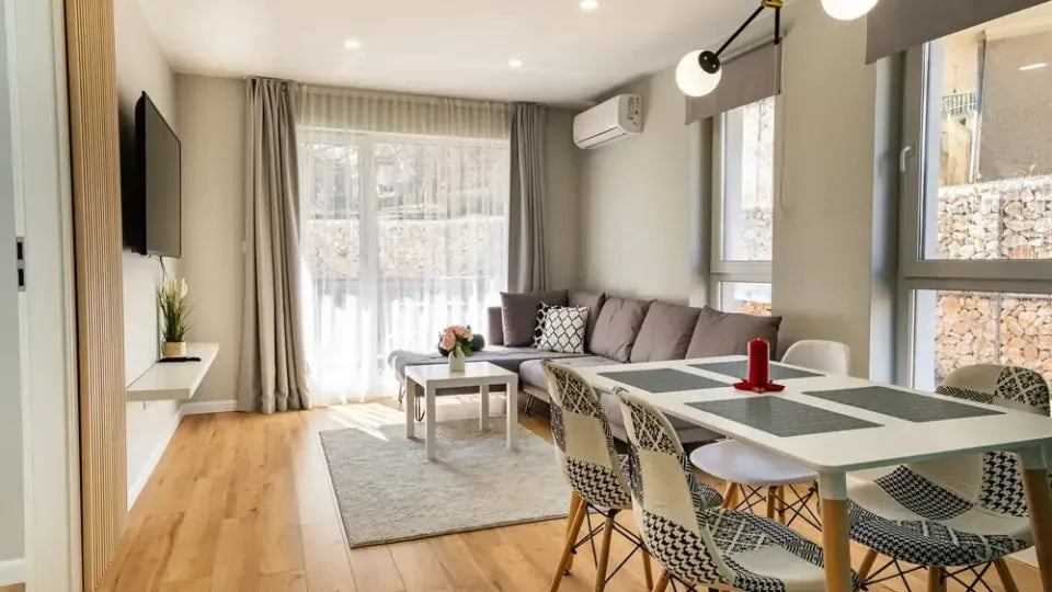 Living room of a Velingrad family apartment with sofa and dining area