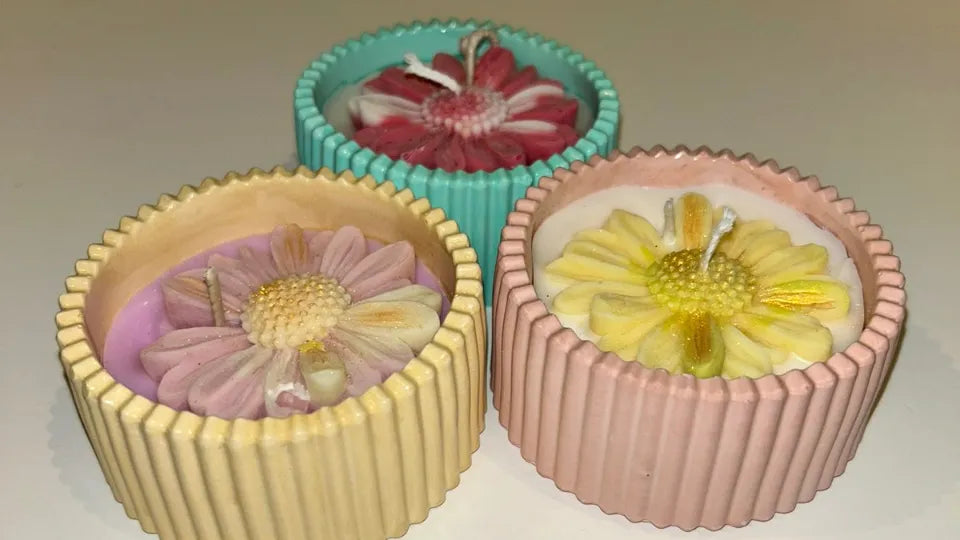 Decorating candles with dried flowers and pigments in a Sofia art workshop