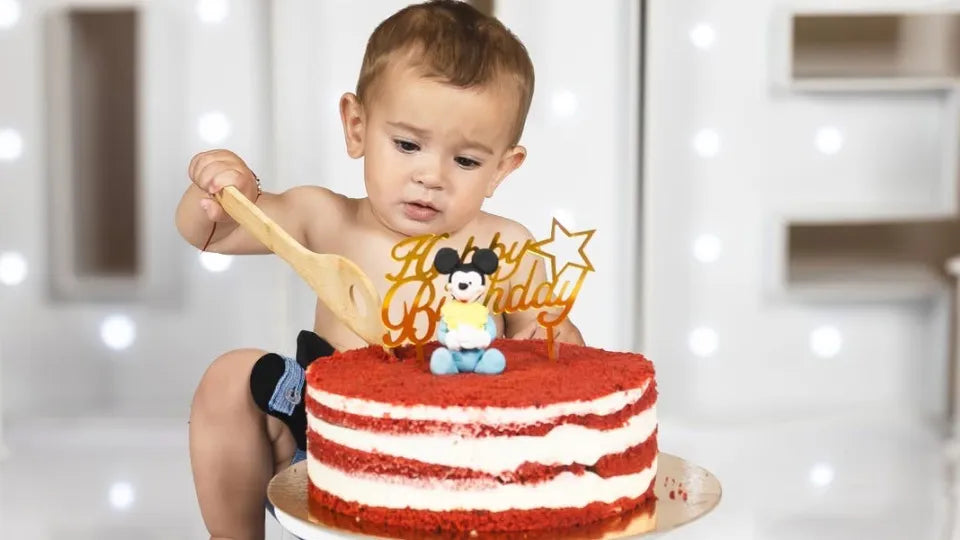 Baby exploring cake during smash cake session in Sofia