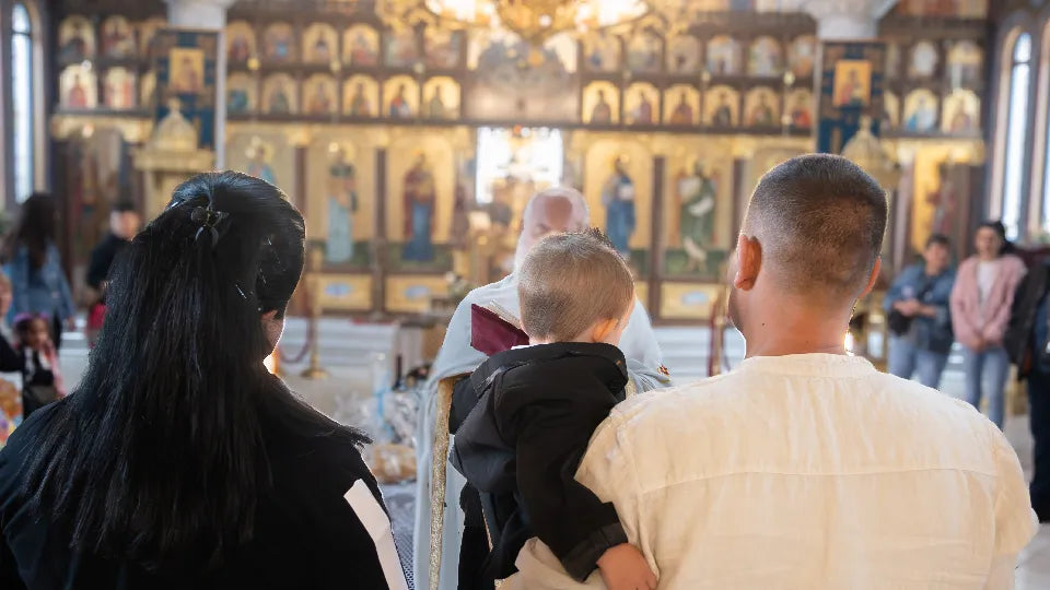 Family hug after the baptism ceremony in Sofia