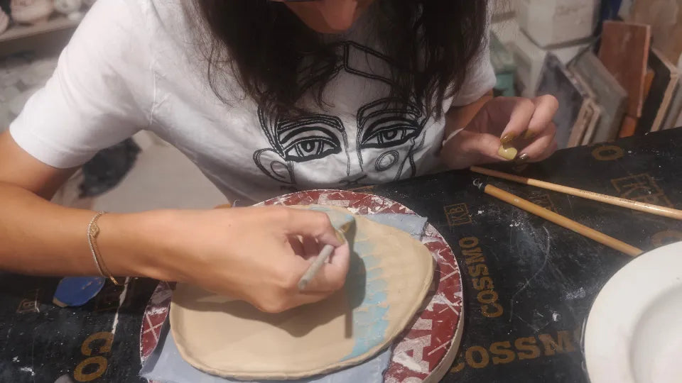 Pottery and wine workshop in Sofia – participant shaping clay in a cosy studio