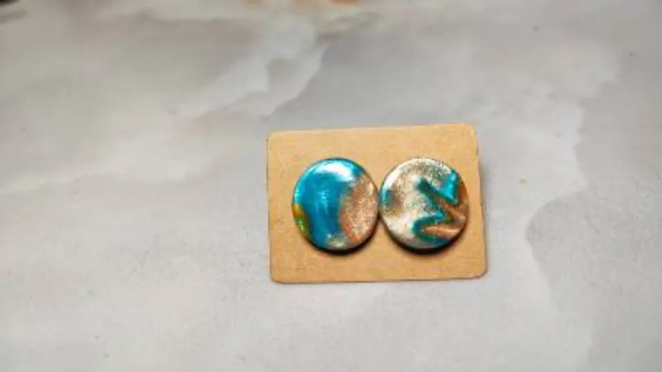 Shaping polymer clay earrings during a jewelry class in Sofia