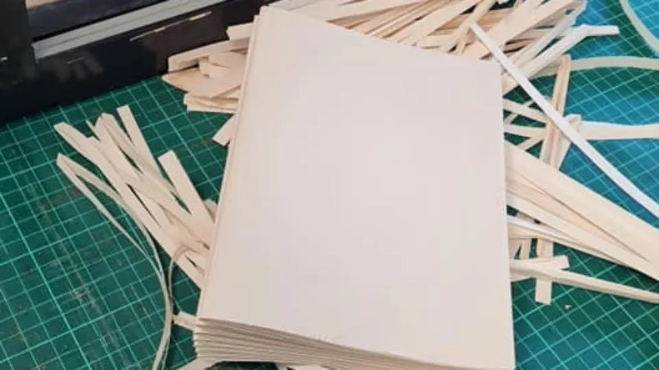 Participant making a hand‑bound notebook during a workshop in Veliko Tarnovo
