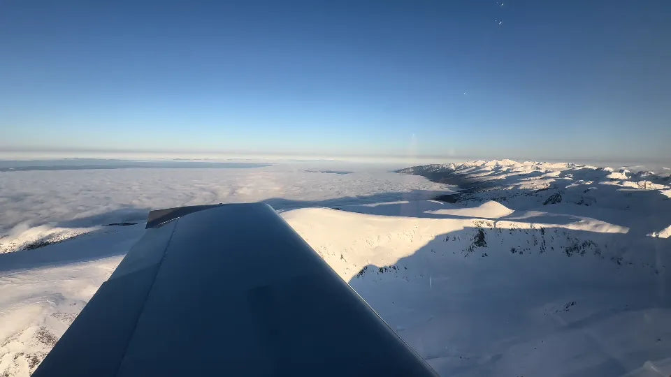 Borovets and Iskar Reservoir views during winter mountain flying lesson