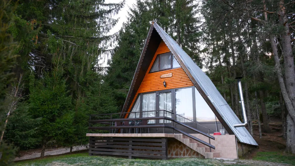 Villa stay by Dospat Reservoir – A-frame exterior among pine trees