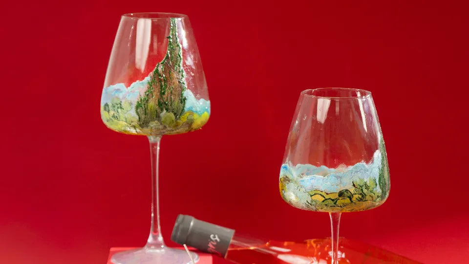 Group class setup with glass paints, brushes and blank wine glasses in Sofia